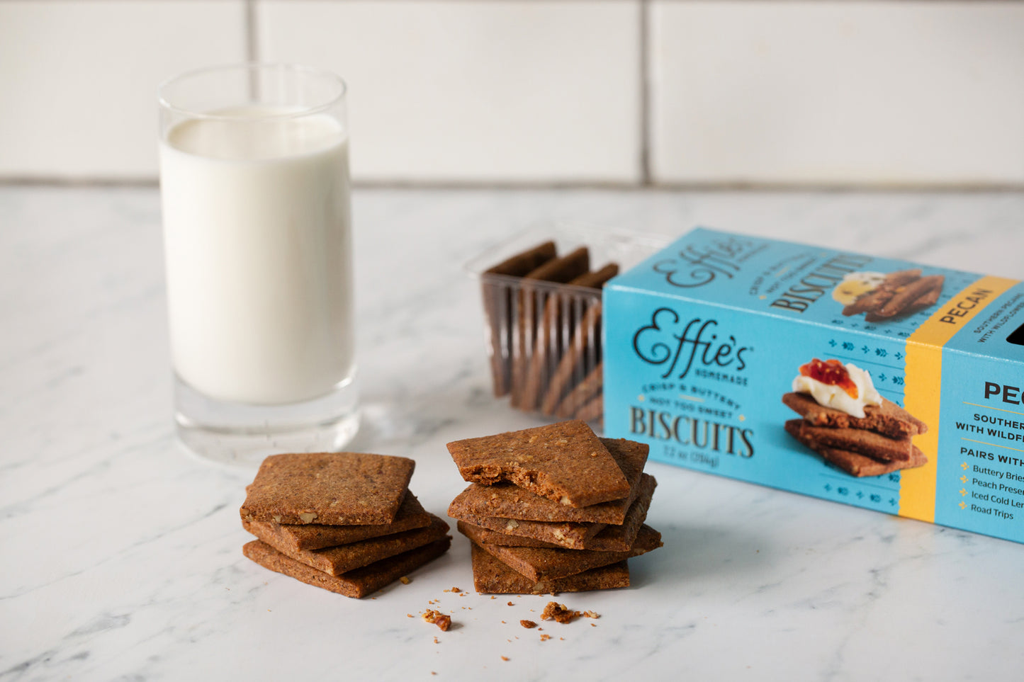 A stack of Effie's Pecan Biscuits paired with a glass of milk.