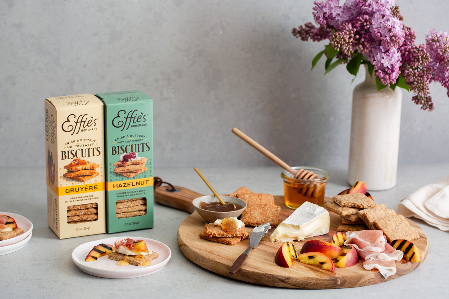 Effie's Hazelnut and Gruyere Biscuits arranged with creamy brie, fresh peaches, salty prosciutto and honey.