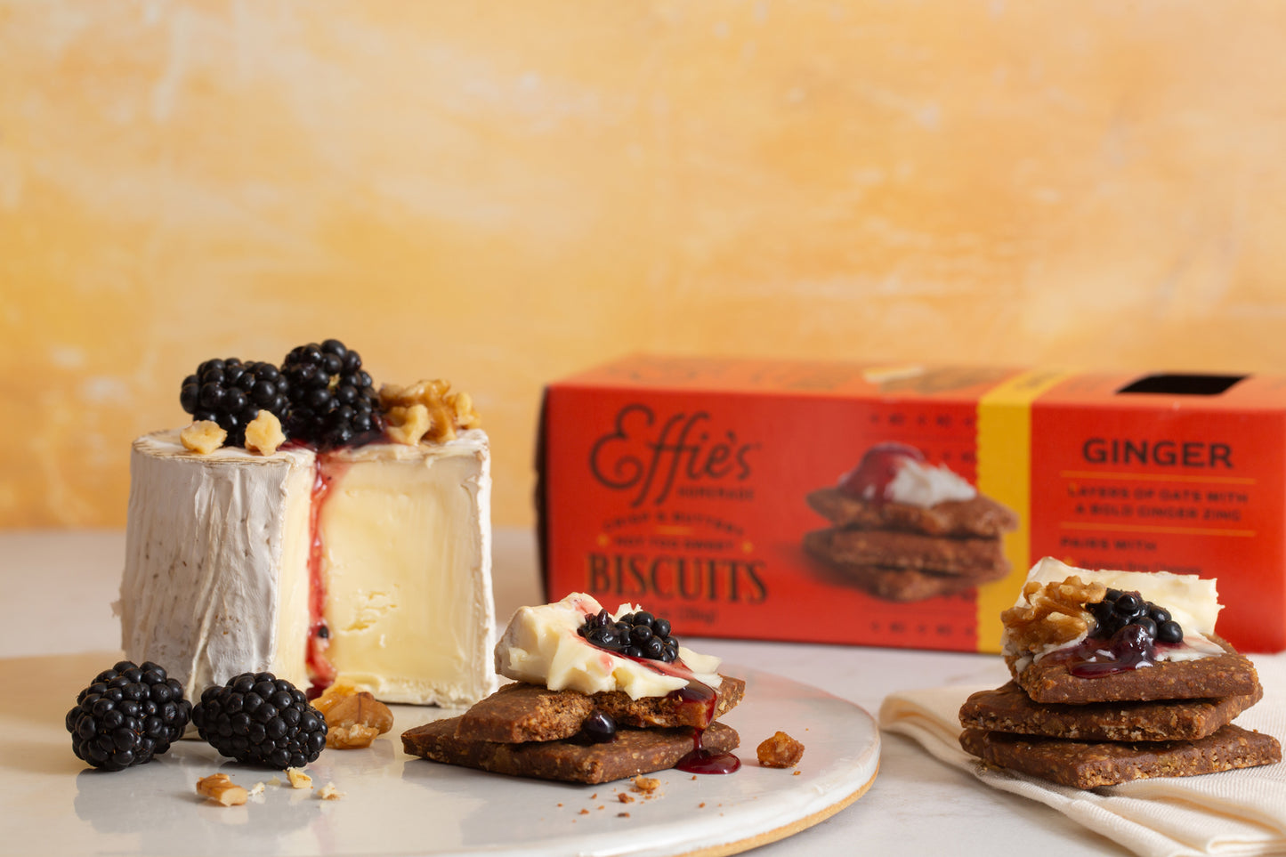 Effie's Ginger Biscuits topped with buttery brie cheese and fresh blackberries and walnuts.